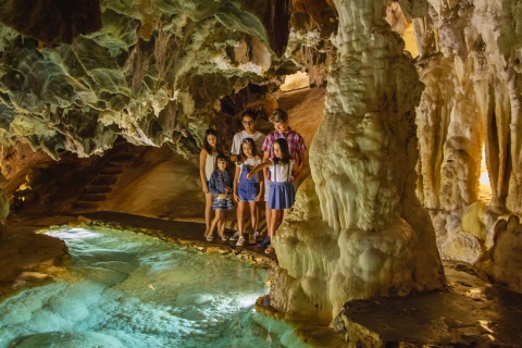 Group of children visiting the Palmatoria, at the Gruta de las Maravillas cave in Aracena. Huelva, Andalusia