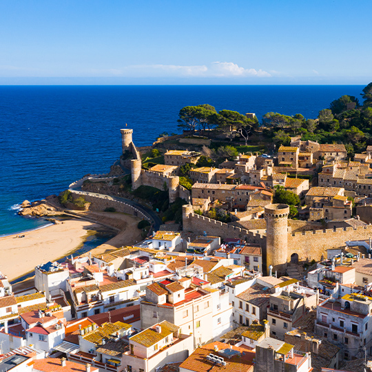 Aerial view of the small village of Tossa de Mar, between the sea and the mountains of Gerona