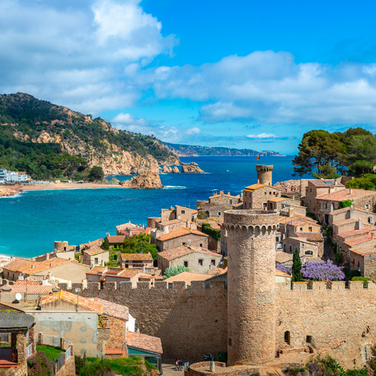 Views from the city wall of the historic quarter of Tossa de Mar and its beaches