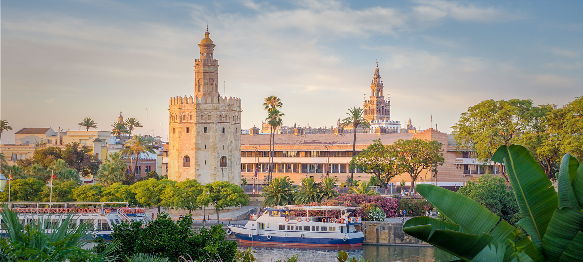 The Torre del Oro with the Giralda in the background, in Seville, Andalusia