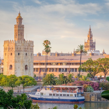 The Torre del Oro with the Giralda in the background, in Seville, Andalusia