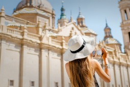 Tourist taking a photograph of the Basílica del Pilar in Zaragoza, Aragón