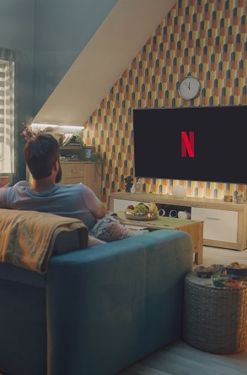 Short film competition_Someone in their living room with Netflix on TV © Frame Stock Footage