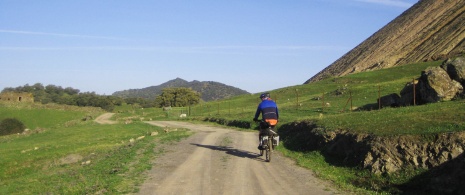 Cycle tourist on the TransAndalus route close to Santa Olalla del Cala in Huelva, Andalusia