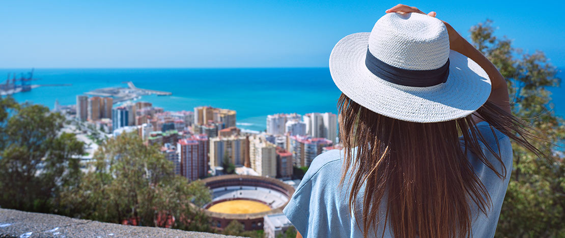 Girl looking at the view from the Gibralfaro viewpoint in Malaga, Andalusia Girl looking at the view from the Gibralfaro viewpoint in Malaga, Andalusia