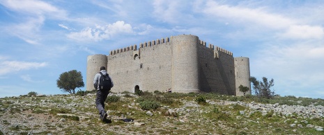 Tourist walking towards Montgrí castle, Girona, Catalonia