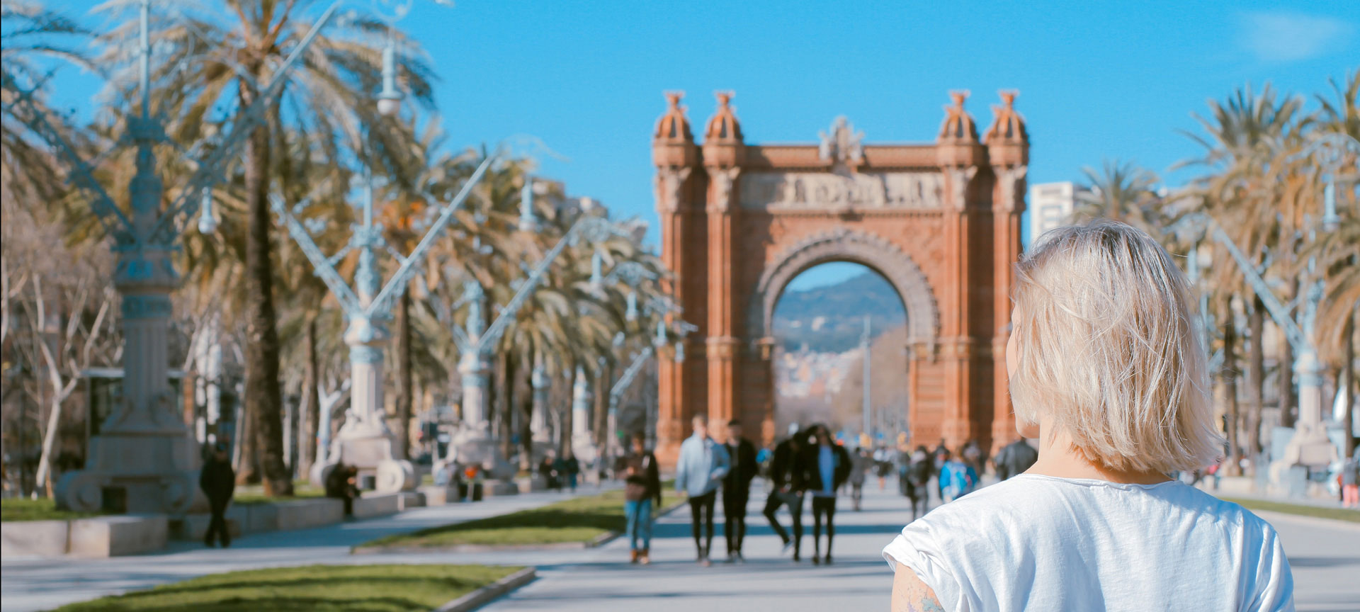 A tourist by the Arc de Triomf in Barcelona A tourist by the Arc de Triomf in Barcelona