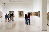 Room with visitors inside the museum