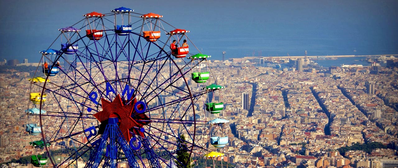 Tibidabo ferris wheel with Barcelona in the background Tibidabo ferris wheel with Barcelona in the background